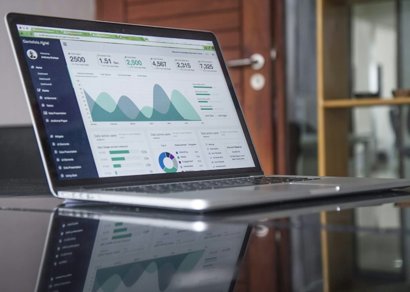 Laptop showing an ads analytics dashboard