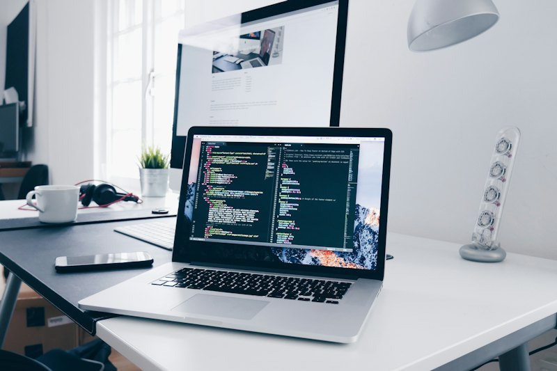 Laptop with website code on screen